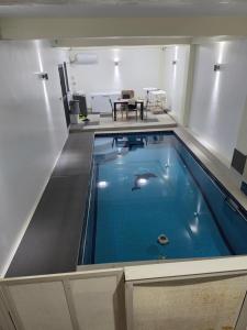 a large swimming pool in the middle of a room at 77 Fulaga Flats in Suva +10 photos