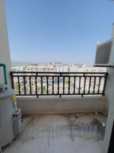 a balcony with a view of a parking lot at Stay lux yellow in Islamabad