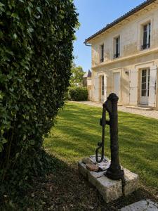 a water pump in the yard of a house at Château Alto Cormeil in Saint-Émilion