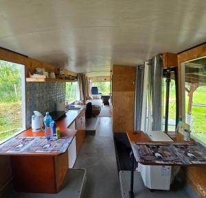 an interior view of a kitchen in an rv at Atomi CountryBus in Aucugals