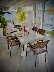 a white table and chairs in a room at affittacamere Villa Masá in Zingarello