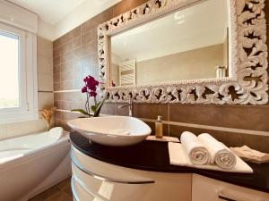 a bathroom with a sink and a mirror at Anna's Cozy Nest a Udine in Udine +31 photos