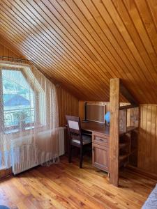 a room with a desk and a chair and a window at Під Боржавою in Volovets