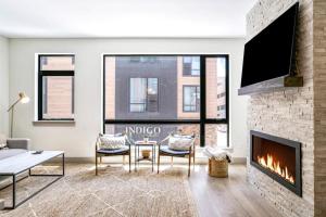 a living room with a couch and a fireplace at Skywalk Flats Escape in Silverthorne