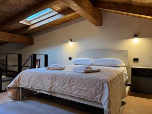 a bedroom with a large bed with pillows on it at Atelier Volturno in La Maddalena