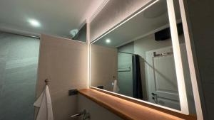 a mirror in a bathroom with a shower at House RudNik in Silent Village, Island Krk in Isola Veglia +56 photos