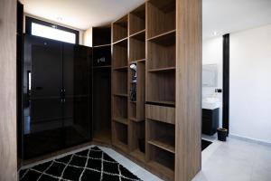 a bathroom with a walk in shower and a sink at Villa 4 chambres avec piscine in Tangier +15 photos