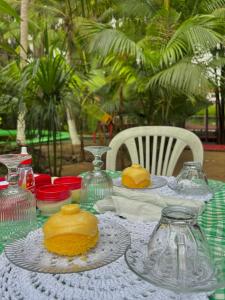 a table with glass vases on top of it at Pousada Vale dos Buritis in Barreirinhas +28 photos
