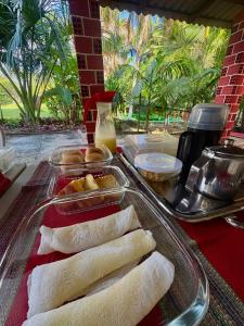 a table with a tray of food on a table at Pousada Vale dos Buritis in Barreirinhas