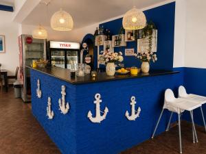 a blue counter with anchors on it in a restaurant at Zajazd Nadmorski in Stegna