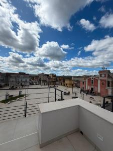 a view of a city from the balcony of a building at Al58 Casa Vacanze in Villasmundo