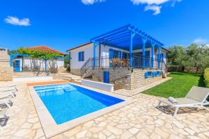 a villa with a swimming pool and a house at Villa Umag Istria seaview private pool and garage by Rentistra in Umag