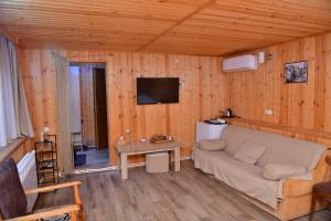 a living room with a couch and a table at Hayi Tun Guest House in Goris