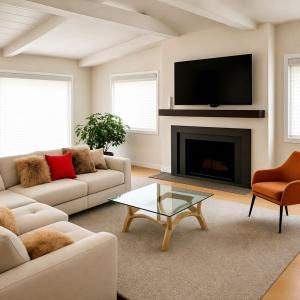 a living room with two couches and a fireplace at VAIL MOUNTAIN SUITE in Vail