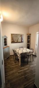 a dining room with a table and chairs at Casa Principe Taranto "Intero appartamento INDIPENDENTE" in Taranto