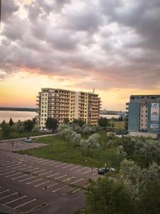 a parking lot with two tall buildings and a parking lot at SeaLaVie - Summerland Mamaia in Mamaia