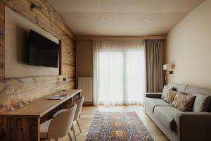 a living room with a couch and a table at Albergo Stella in La Villa