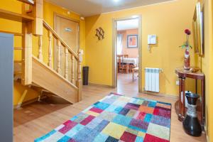 a living room with a colorful rug on the floor at AG Piso Vazquez Parga Carballo in Carballo