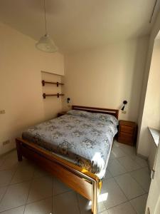 a bedroom with a bed in a room at Bastianina's home in Marciana Marina