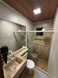a bathroom with a sink and a toilet and a shower at Condomínio Feitosa Barros I in Maceió +118 photos