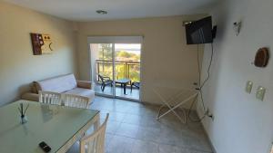 a living room with a couch and a table at Los Abus in Colón