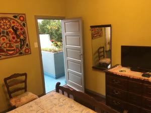 a dining room with a dresser and a mirror at TERRAZAS DEL SUR in Ezpeleta