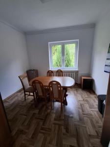 a room with a table and chairs and a window at Pokoje na lato Gdynia in Gdynia +21 photos