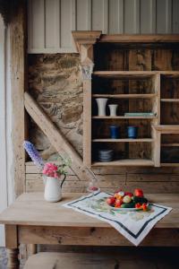 a table with a plate of fruits and vegetables on it at Flowland Tarczyn in Tarczyn +34 photos