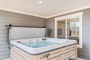a bath tub sitting in the corner of a room at Elk Grove Getaway in Ponderay +62 photos