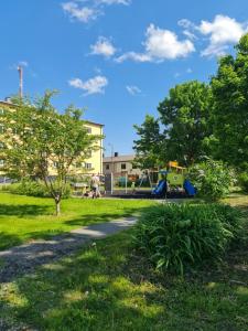 a park with a playground in the grass at Comfort apartment in Rakvere in Rakvere