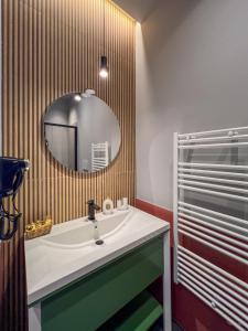 a bathroom with a sink and a mirror at Villa Scarpino in Massignano +37 photos
