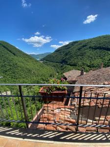 a balcony with a view of a mountain at La casina di Viola in Posticciola