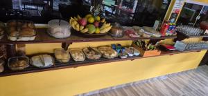 a shelf filled with lots of fruits and other items at Pousada Recanto Sapoti in Barreirinhas +45 photos