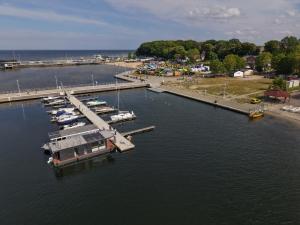a group of boats docked at a dock in the water at Water House in Puck