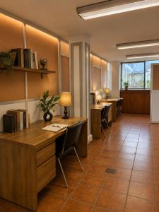 an office with desks and chairs in a room at Mariachi House in Mexico City