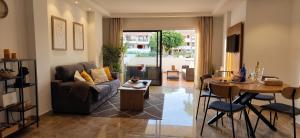 a living room with a couch and a table at Mandarina 119 in San Miguel de Abona