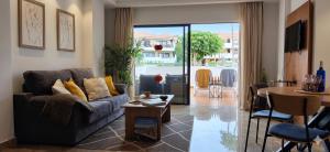 a living room with a couch and a table at Mandarina 119 in San Miguel de Abona