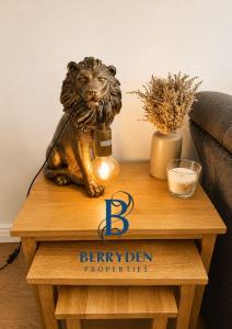 a table with a lion statue on top of a table at Restmore House in Inverugie Mill