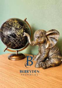 a statue of an elephant playing with a ball at Restmore House in Inverugie Mill +8 photos