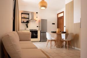 a living room with a couch and a table at Casa Pescoluse 50m dal Mare in Marina di Pescoluse +37 photos