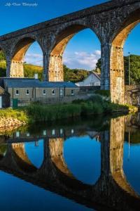 a bridge with three arches over a body of water at Salt View in Cullen +22 photos