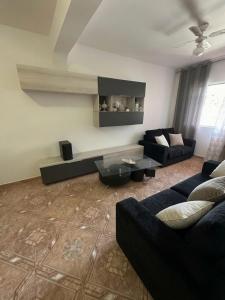 a living room with a couch and a table at Recanto da Paz in Tarrafal