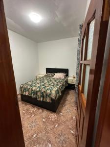 a bedroom with a bed in a room at Recanto da Paz in Tarrafal