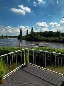 a bridge over a river with boats on it at Lesum View Apartment Bremen in Bremen