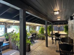 a patio with a table and chairs and plants at The Inn at Zaca Creek in Buellton