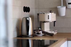 a coffee maker on a counter in a kitchen at Dům U babičky in Laškov