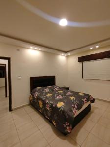 a bedroom with a bed in a room at مزرعة لافين in Jerash