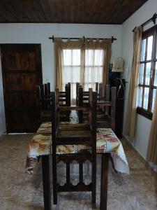 a dining room table and chairs in a room at Cabañas amanecer alegre in Salta