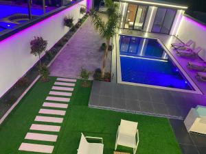 an overhead view of a house with a swimming pool at Aurora villa in Rrushkull +2 photos