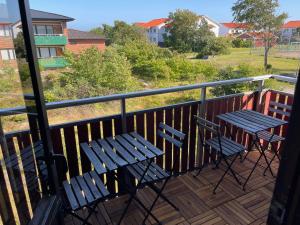 two chairs and a table on a balcony at Lysekil Apartment Hotel in Lysekil